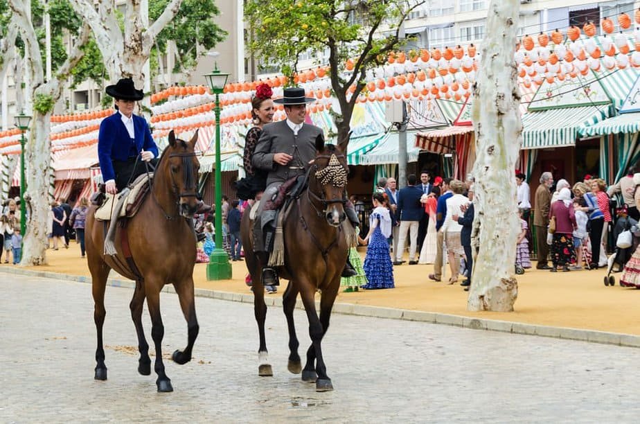 Sevillians during the Feria de Abril Riding horses dressed in national feria clothes